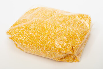 corn porridge in a plastic bag on white background