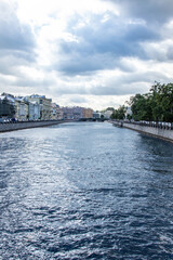 City river channel. Bridge. Gloomy sky.