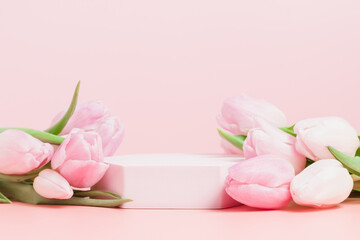 Empty podium with tulips to display cosmetics, perfume and products