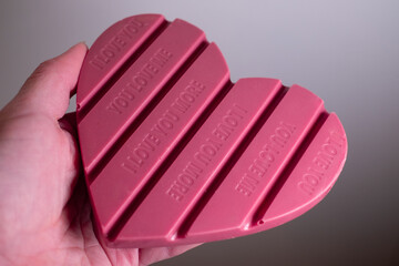 Pink heart shaped chocolate bar with text 