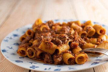 Rigatoni with bolognese sauce on a plate