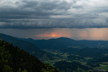 View of storm and clouds over the mountains in the summer season. thunderstorm and rain.