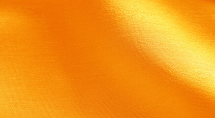 Luxurious golden silk or satin texture for background. luxurious background design.