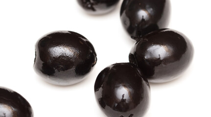 Black olives isolated on a white background.
