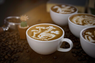 cup of coffee latte art in barista hand.