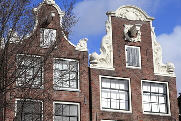 Fototapeta premium Amsterdam Brouwersgracht Canal Historic House Facades Close Up with Sculpted Fish, Netherlands