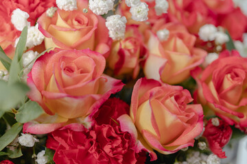 Gift basket with flowers on a white background. Roses, carnations. Flower composition. Gift for Valentines Day.
