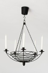 Candlestick chandelier. Detail. Minimalist and clean interior accessory.