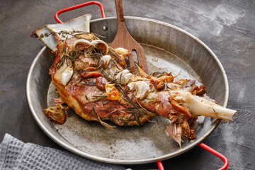 Roasted lamb shoulder with garlic, rosemary and thyme.  Lamb meat, shoulder of mutton with spices. Lamb leg fillet ready to eat. Selective focus