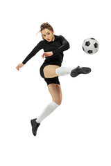 Attacking player. One sportive girl, female soccer player training with football ball isolated on white studio background. Sport, action, motion, fitness