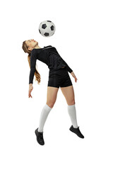 Jumping. One sportive girl, female soccer player training with football ball isolated on white studio background. Sport, action, motion, fitness