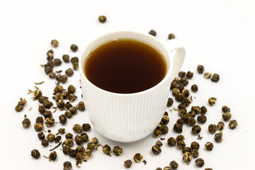 Jasmine Pearls Green Tea on a white background. medicinal asian herbal tea