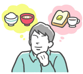 ご飯とパンをイメージし、和食と洋食どちらのメニューにするか迷若い男性