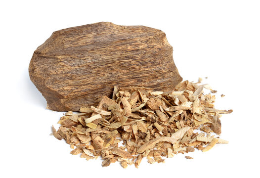 Agarwood, aloeswood, eaglewood or gharuwood. Piece of wood and shavings. Isolated.