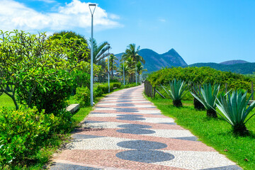Cement walkway or pedestrian boulevard in Camboinhas Beach, Niteroi, Brazil. - obrazy, fototapety, plakaty