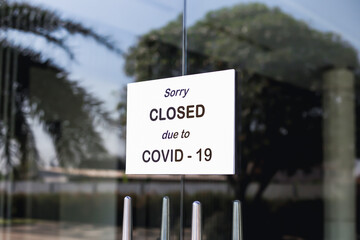 The sign in front of the office is temporarily closed.