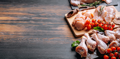 Prepared for frying, butchered various portions of raw chicken meat. Set of raw chicken fillet,...