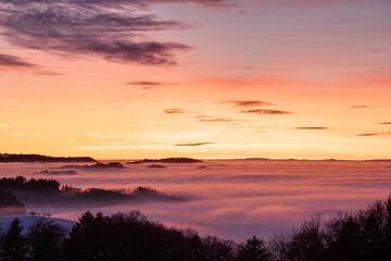 Fototapeta na wymiar Sunset above a sea of fog