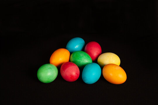 Bright colorful easter eggs on black background.
