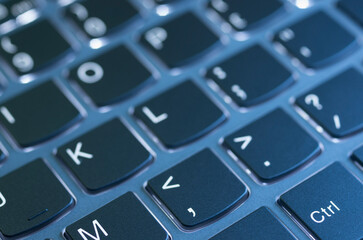 Laptop keyboard illuminated by a nice blue light