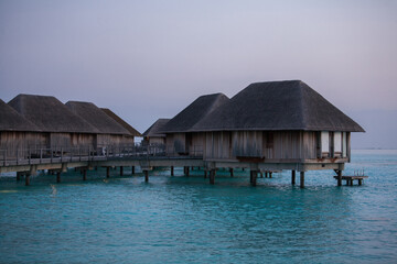 Fototapeta na wymiar Water Bungalows in Turquoise Sea at Maldives