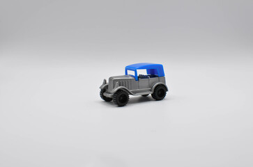plastic toy retro car on white background