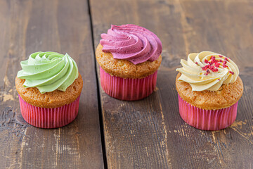 assorted cupcakes on an old wooden table