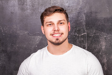 Close up portrait of a young guy in a white t-shirt