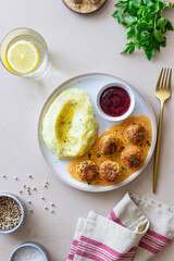 Swedish meatballs in cream sauce, potatoes and lingonberry sauce. Swedish cuisine. Recipe.