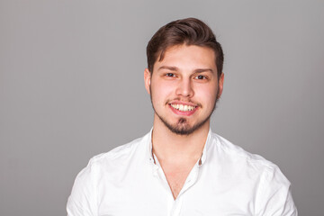Obraz premium Close up portrait of a young guy in a white t-shirt