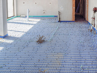 Underfloor heating before pouring concrete screed. energy efficient construction, shallow depth of...
