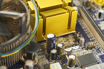 Old computer system unit with spiderweb and dust inside.