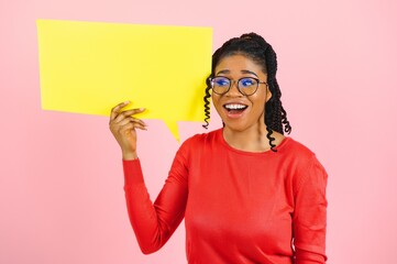 Don't Miss. Excited shocked black girl holding empty speech bubble, over pink studio wall, free space