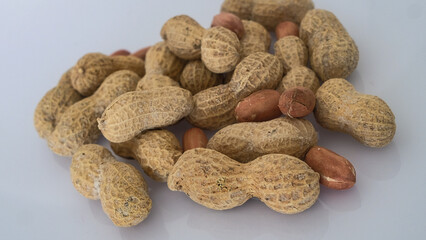 Peanuts on white background - shelled peanuts