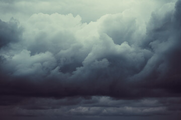 Storm sky with dark grey cumulus clouds.  Thunderstorm