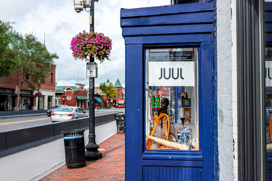 Washington DC, USA - August 18, 2021: Georgetown M street sign for entrance to store for Havana Smoke shop with Juul tobacco cigarettes cigar shop