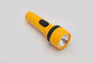 yellow flashlight isolated on a white background using as reserved emergency power
