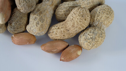 Peanuts on white background - shelled peanuts