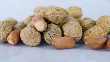 Peanuts on white background - shelled peanuts