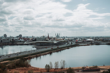 the city of Kazan is high with a view of the main Kazanka river and a long bridge during the day in cloudy weather
