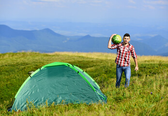 Man bring watermelon for picnic in mountains. Summer vacation. Pleasant hike picnic. Fruits healthy...