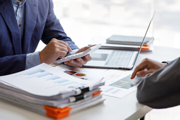 Financial Business team present. Business man hands hold documents with financial statistic stock...