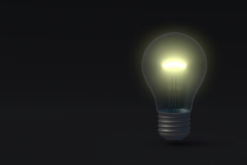 Glowing light bulb on black background. Copy space. Concept of idea. 3d render