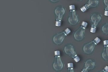 Scattered light bulbs on black background. Copy space. Top view. 3d render