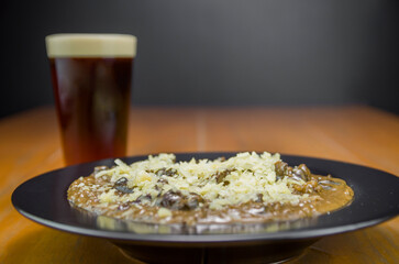 Tasty funghi risotto with meat and cheese