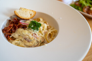 Pasta Spaghetti with black truffle, white mushroom, Cream Sauce and ricotta cheese. woonden background.