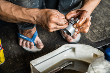 Mechanic Cleaning Car Component