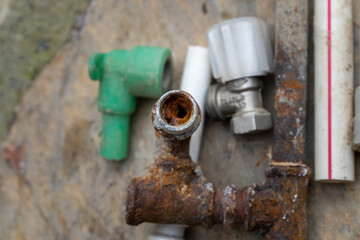 Rusted and oxidized galvanized water pipe, closeup of waste in old water pipes Clogged debris and...