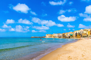 Sandy beach in Cefalu town, Sicily island, Italy. Cefalu has a long and lovely beach with clean, golden sand. Is one of the best in Sicily