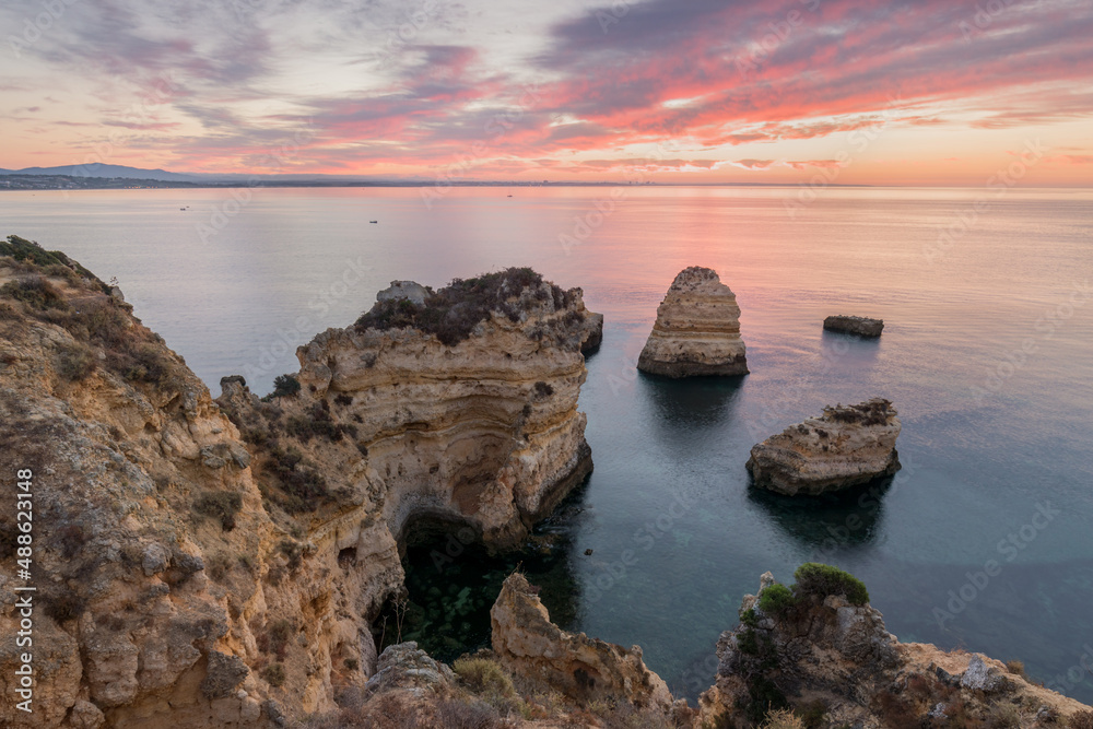 Wall mural Coastal cliffs of Algarve, Lagoa, Portugal Summer season in most popular tourist region.